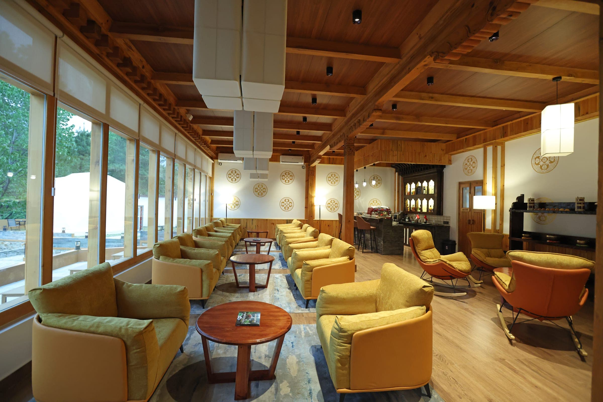 Quiet bar lounge with armchairs at Highland Glamping in Paro, Bhutan