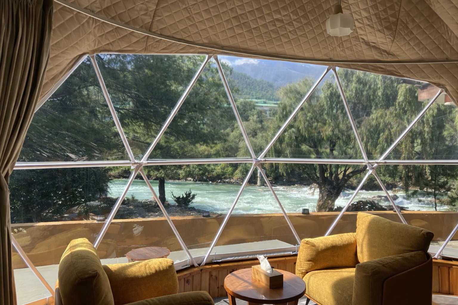 Deluxe Dome panoramic geodesic bay window facing the pine forest at Kepdinkha
