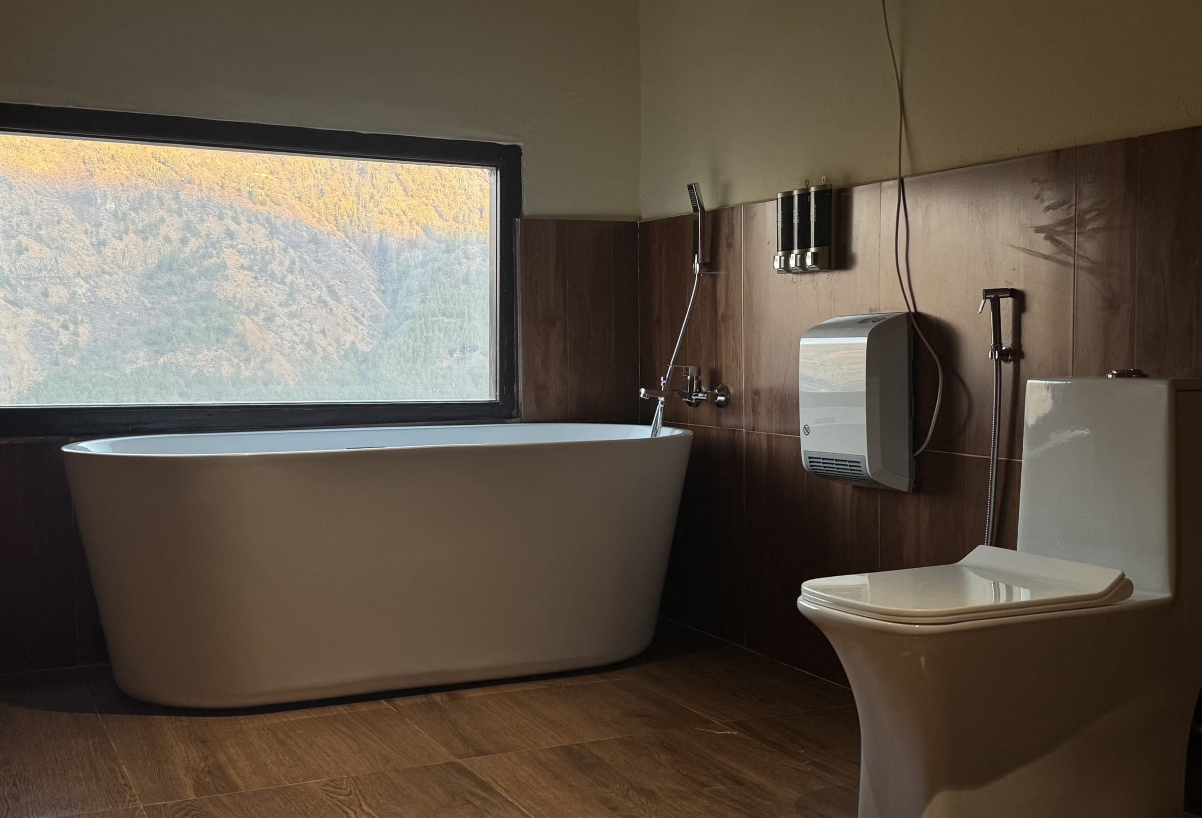 Bathtub set against warm timber interior in the Hilltop Deluxe Dome