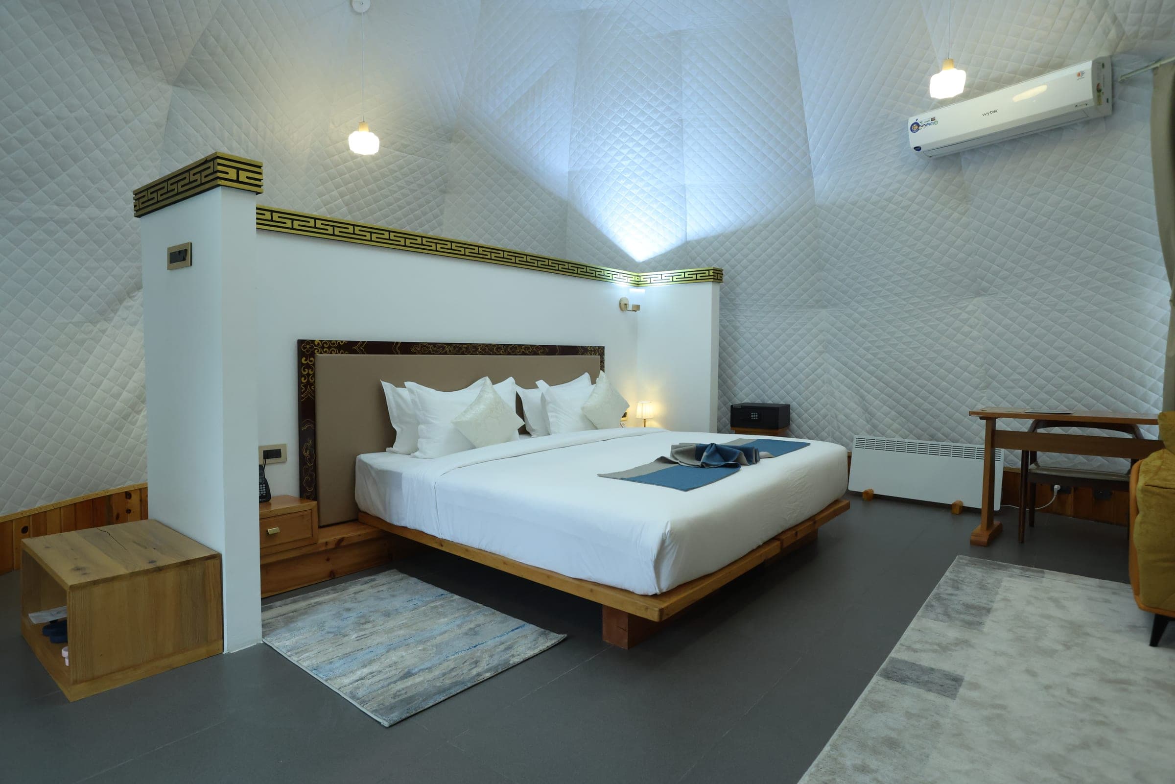 King bed inside a Superior Deluxe glamping dome at Highland Glamping