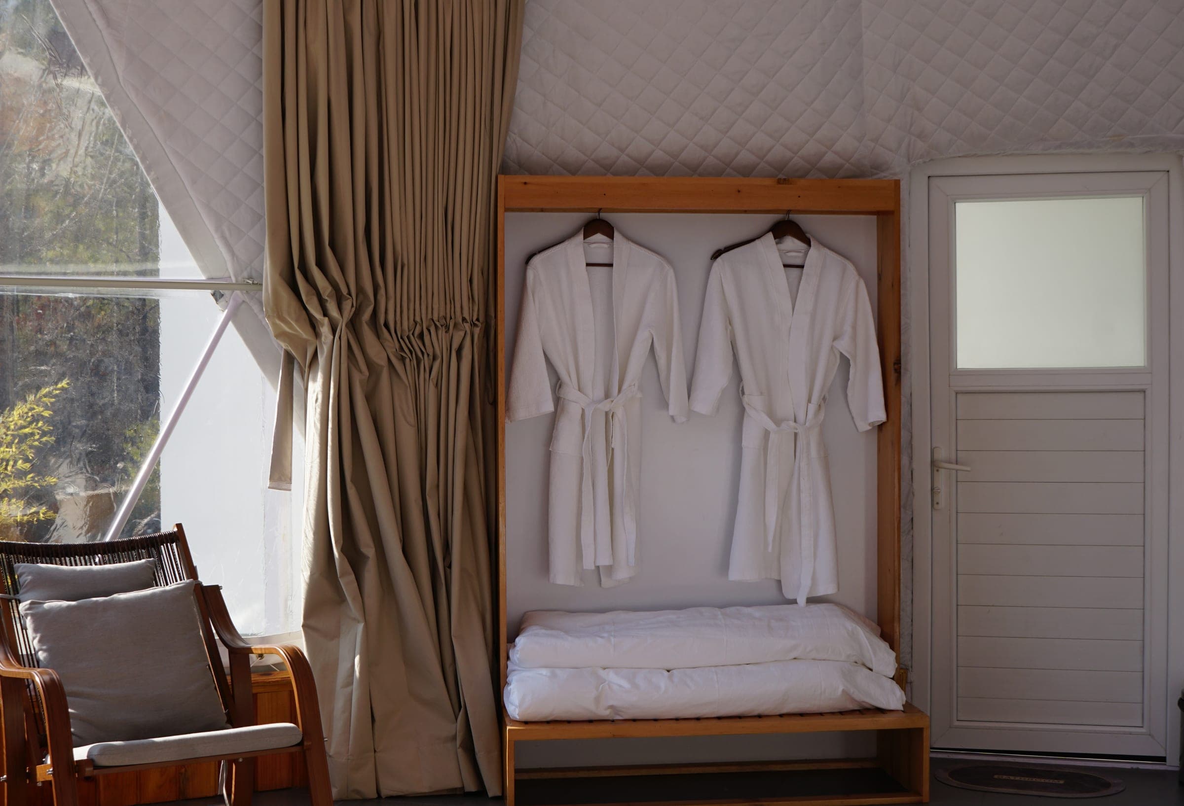 Bathrobes and a rocking chair in the Superior Deluxe Dome