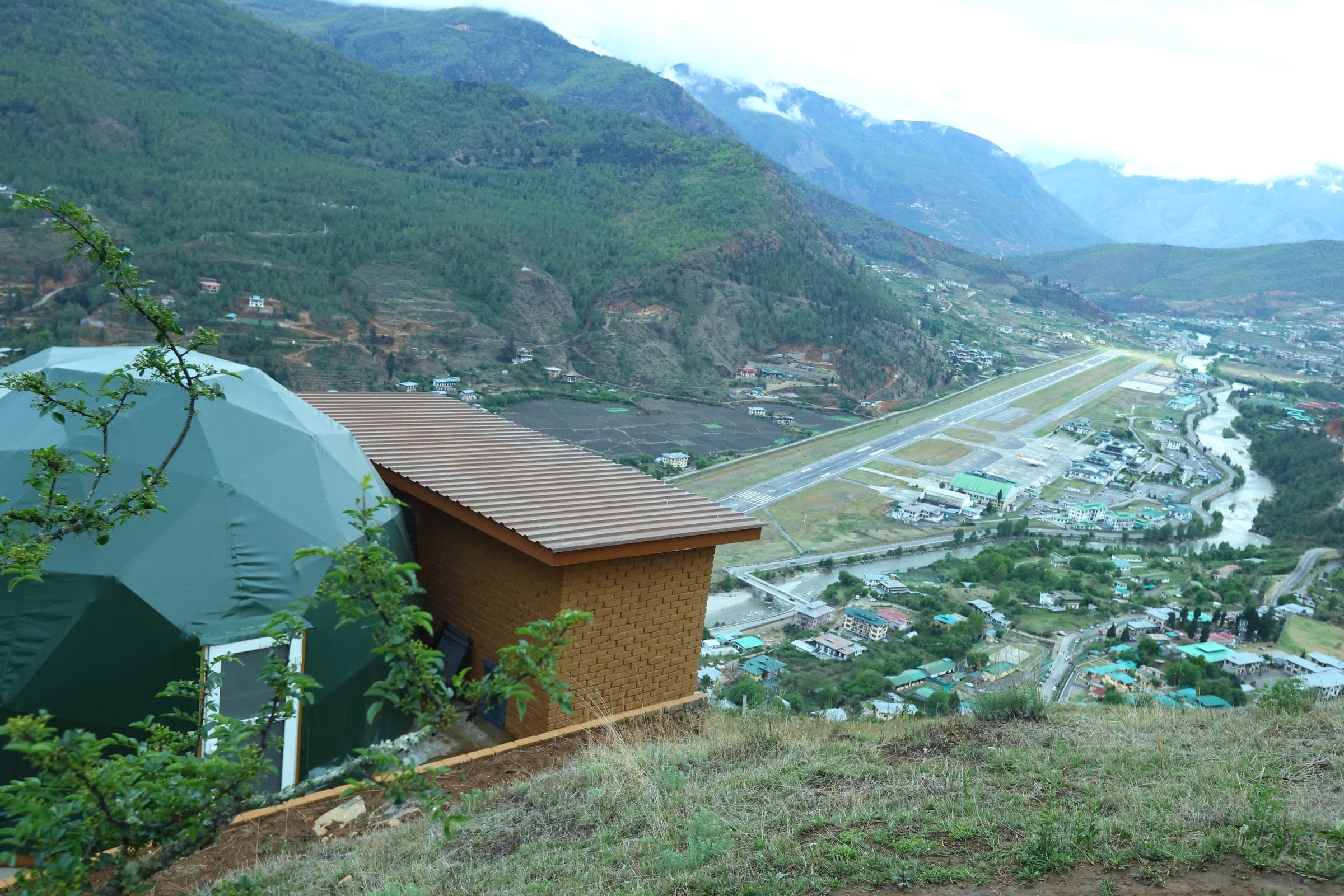 Hilltop glamping dome at Zachakha overlooking the Paro International Airport runway