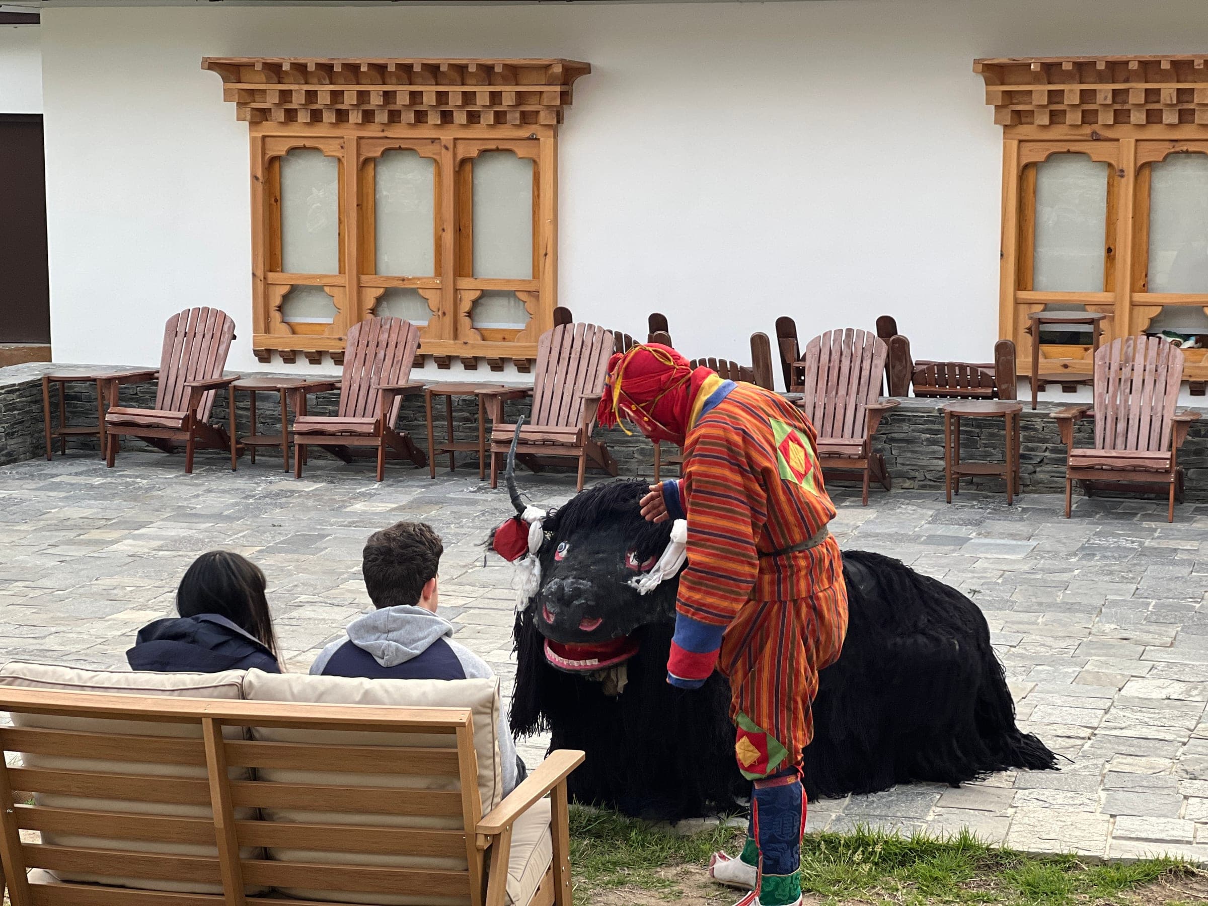 Traditional Bhutanese yak dance performed for guests at Highland Glamping